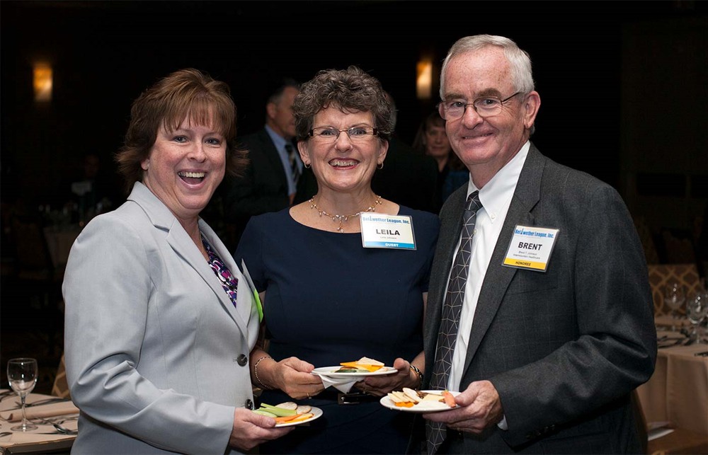 Bellwether Class of 2014 Honoree Brent Johnson (right) with wife Leila Johnson (center) and Intermountain Healthcare executive Jamie Dettloff (left).