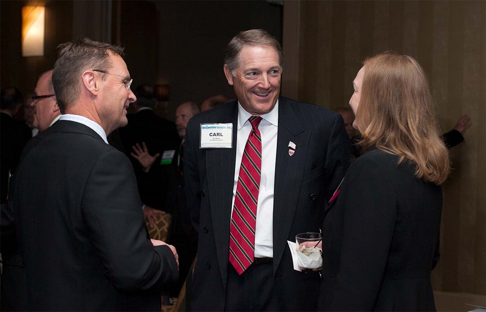 The Wetrich Group’s Carl Meyer (center) chats with HPN’s Kristine Russell (right).