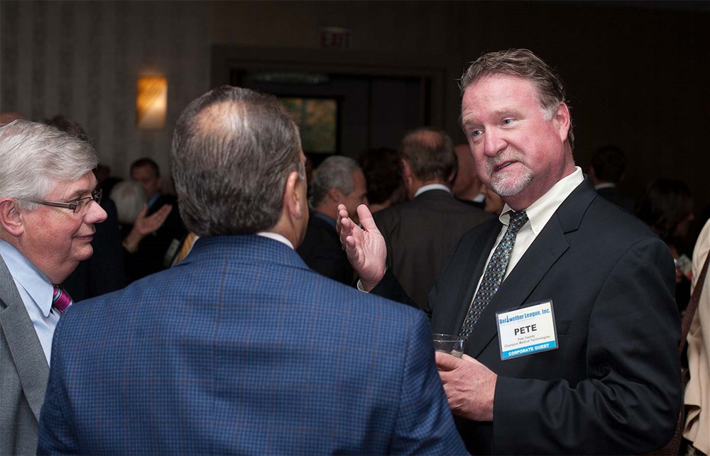 Champion Medical’s Peter Casady (right) makes a point with Bellwether League Inc. Board Member John Strong (Bellwether Class of 2011) (left).