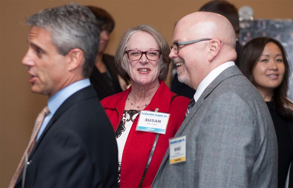 Susan Switzer (center) with husband Mike Switzer (Bellwether Class of 2015) (right).