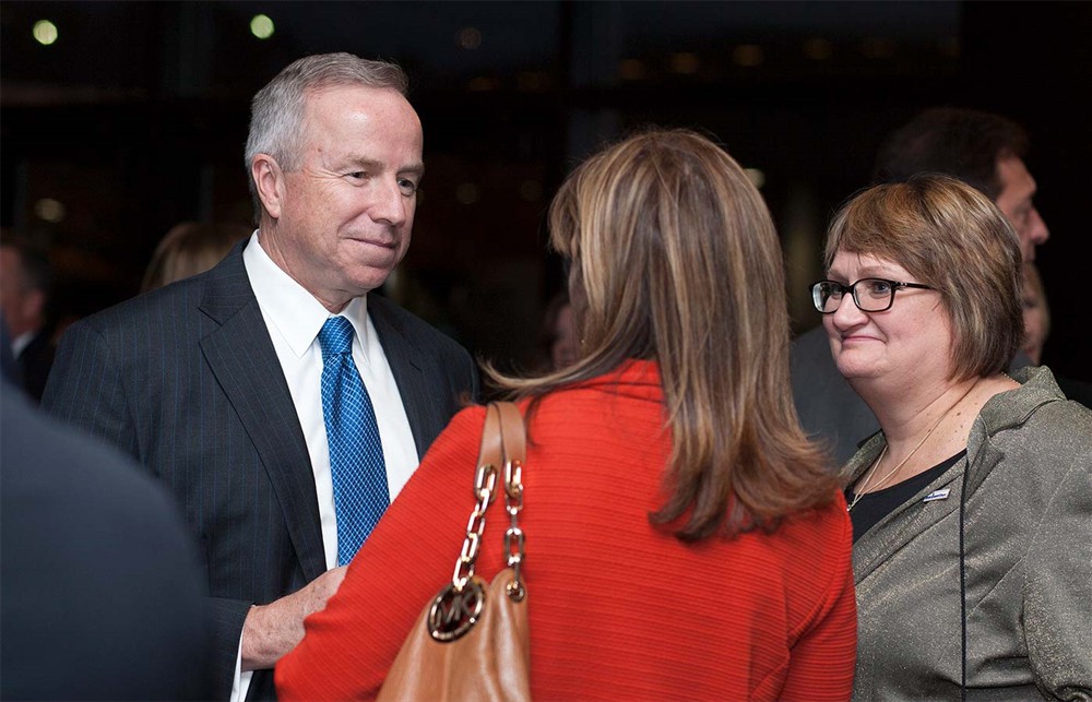 Corporate Sponsor Johnson & Johnson Health Care Systems’ Larry Malloy (left) with Bellwether League Inc. incoming Board Member Deborah Templeton (right) with Corporate Sponsor MedSpeed’s Gail Nelson (center, back to camera).
