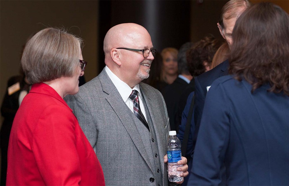 North Mississippi Health Services’ Mike Switzer (Bellwether Class of 2015) (center) with wife Susan Switzer (left) and Corporate Sponsor HealthCare Links’ Ken Murawski (right) and Maria Hames (far right, back to camera).