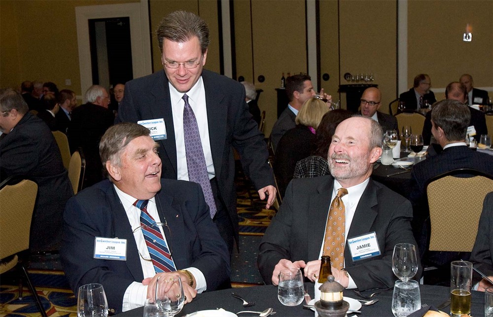 Bellwether League Inc.’s James F. Dickow, Rick Dana Barlow and Jamie C. Kowalski share a laugh during the annual dinner.