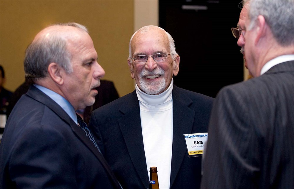 Bellwether Class of 2009 Inductee Sam Raudenbush catches the camera at the right moment while Bellwether League Founding Treasurer Pat Carroll talks with Bellwether Class of 2008 Inductee Lee Boergadine and Bellwether League Secretary John Gaida.