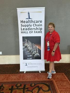 Helen Brann from BLF Silver Sustaining Partner OmniChannel Health, visits the BLF table at AHRMM 2026.