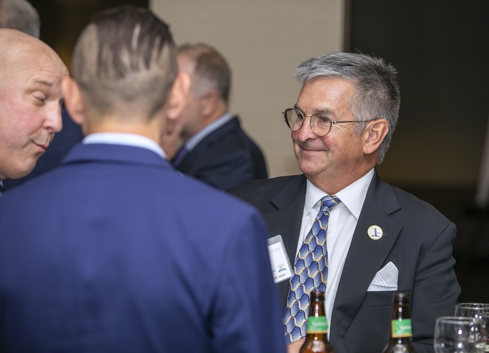 Mark Van Sumeren (Bellwether Class of 2021) enjoys a retort by Dave Myers (Bellwether Class of 2022) with Andy Van Sumeren (back to camera).