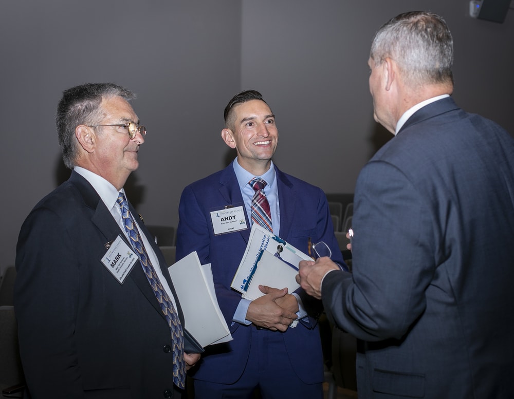 Mark and Andy Van Sumeren enjoy a lighter moment of conversation.