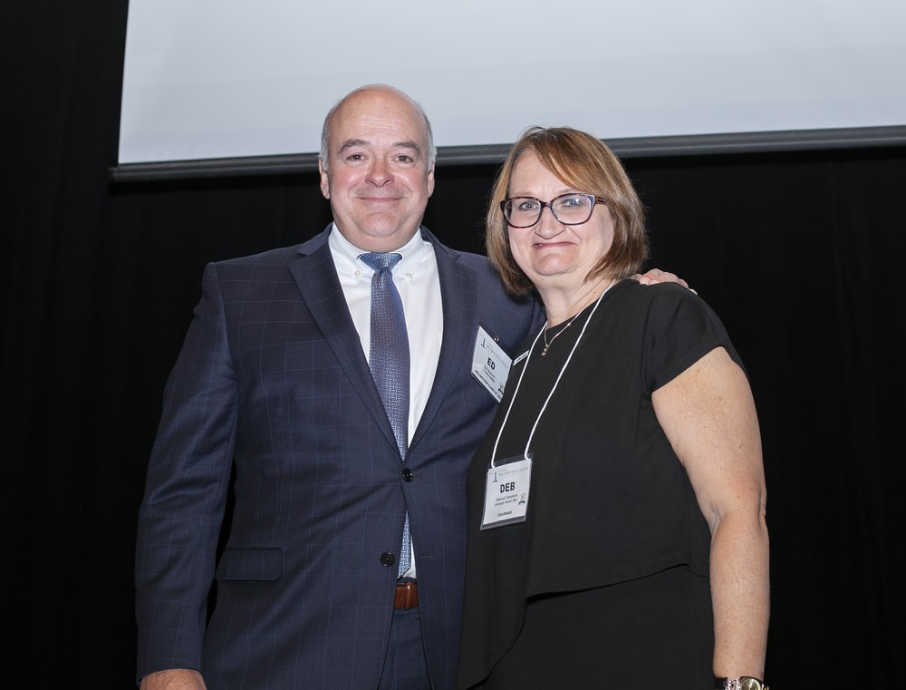 Trinity Health's Ed Hisscock (Bellwether Class of 2022) with BLF Chairman Deborah Templeton.