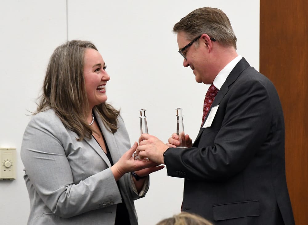 Fellow Ammer Honoree classmates Allison Corry and Jason Moulding share a light-hearted moment on stage.