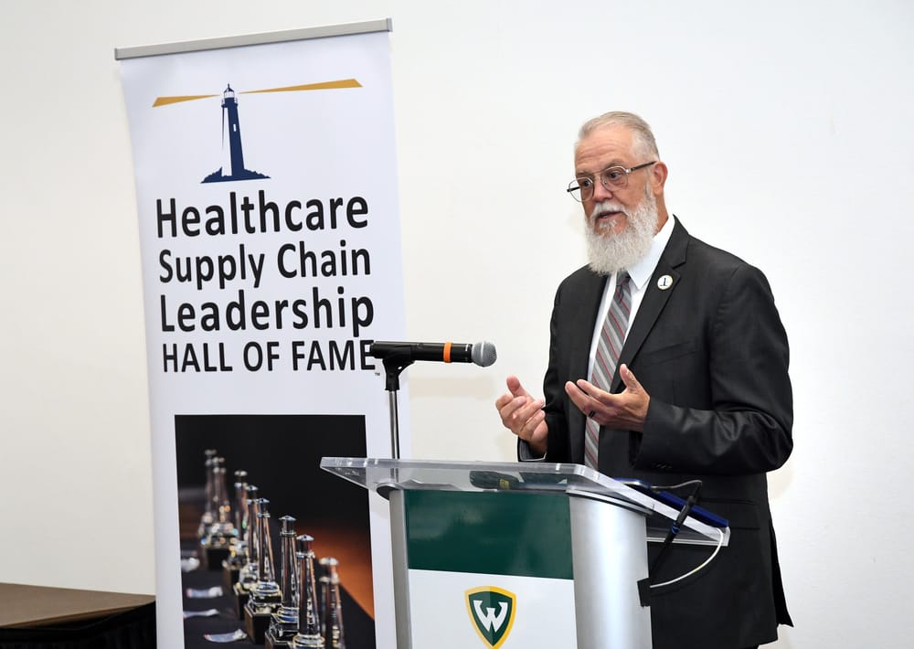 BLF Advisory Council Chairman and Board Member Gary Rakes, Bellwether Class of 2021, introduces the pioneering Claude Trafas (1923-2015), Bellwether Class of 2025, just minutes after arriving at the ceremony due to several flight cancellations brought about by the federal government shutdown.