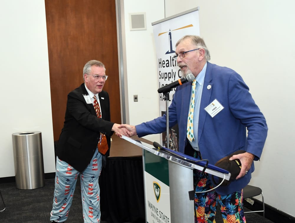 Fred Crans, Bellwether Class of 2020, bestows upon Barlow the honor of being the second recipient of the “prestigious Fred Crans Pants Award (FCPA),” which grants the awardee access to an exclusive cadre of creative and deep thinkers who wear eye-catching trousers that turn heads and inspire discussions. The first recipient was Randy Bradley, Ph.D., Ammer Honoree Class of 2020, back in August. Barlow promptly donned the lighthouse-themed trousers at the podium.
