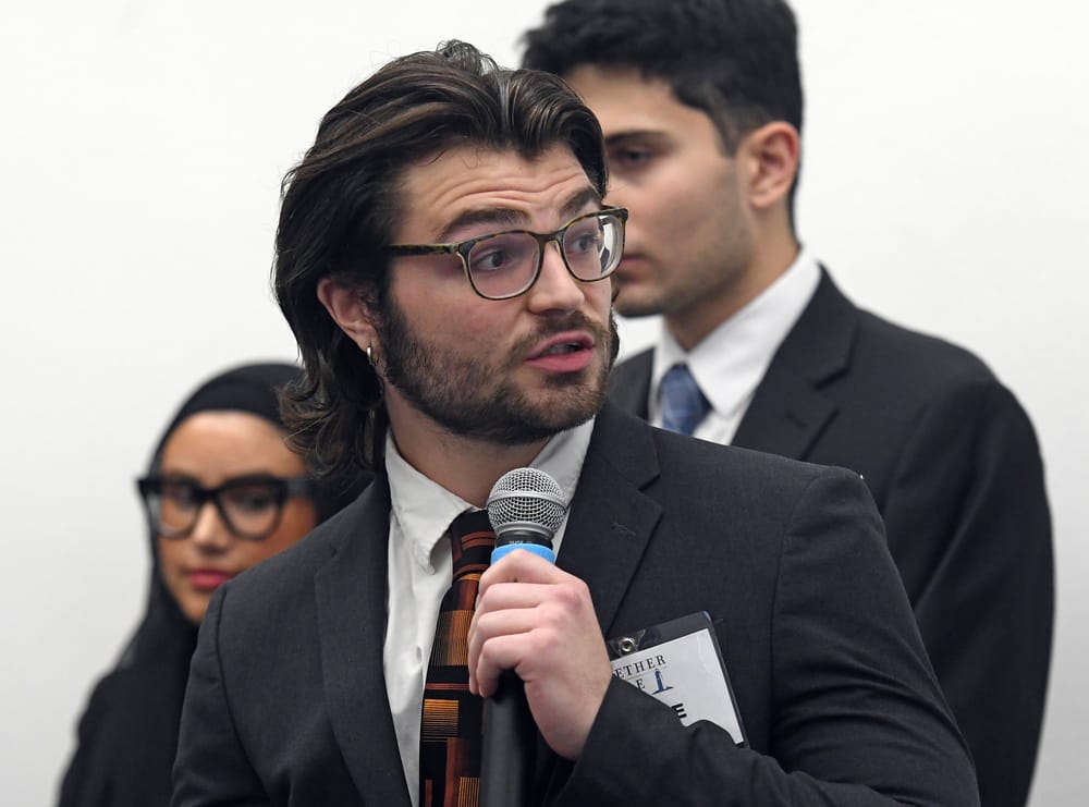 WSU supply chain student Jesse Pratt refers to a slide.