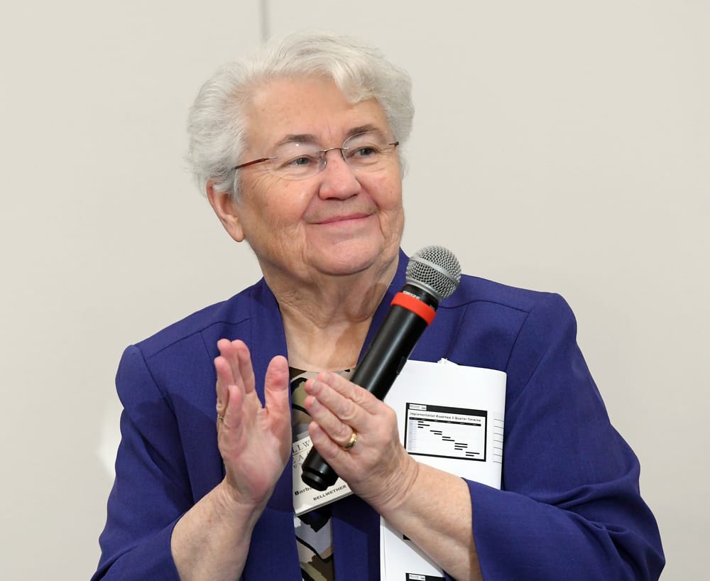 BLF Chairman Barbara Strain applauds the WSU student team for their Collegiate Capstone Project presentation.