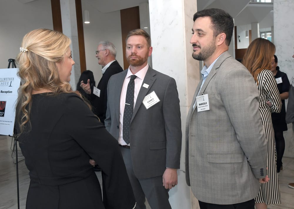 Rachel Anderson, Future Famers Class of 2023, chats with Corey Schmidt, Future Famers Class of 2024, and Clarium’s Marcelo Fracchia.