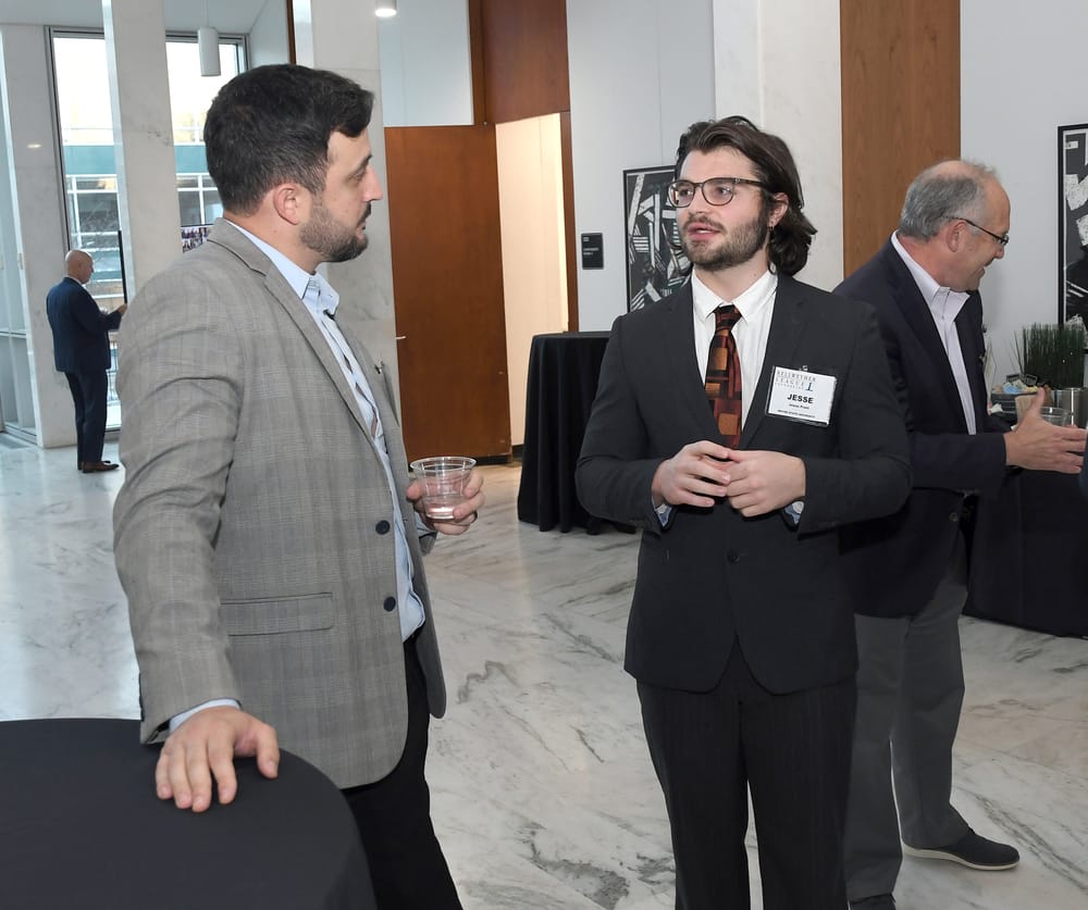 Clarium’s Marcelo Fracchia talks with WSU supply chain student Jesse Pratt.