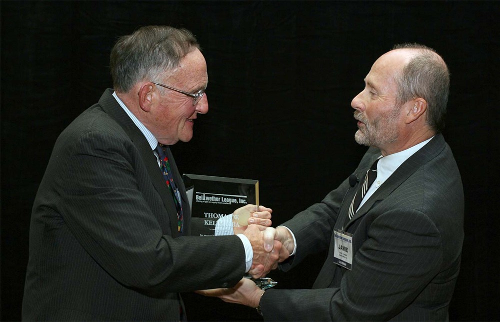 Chairman Jamie C. Kowalski presents Thomas W. Kelly (left) with Bellwether League Inc.'s Honoree Induction award 