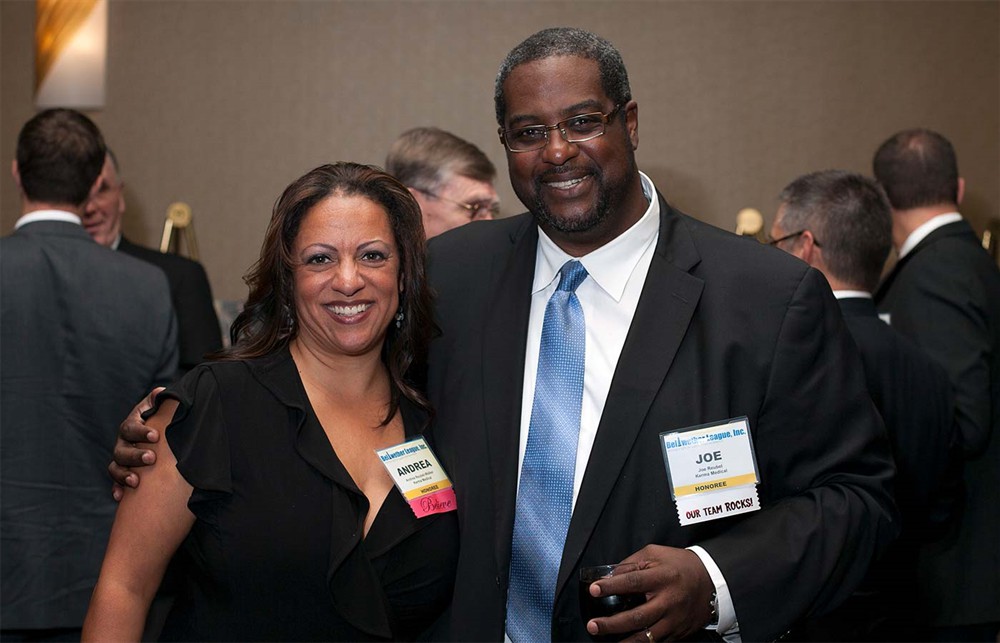 Andrea Reubel-Walker (left) and Joe Reubel (right) represent Bellwether Class of 2014 Honoree Earl Reubel.