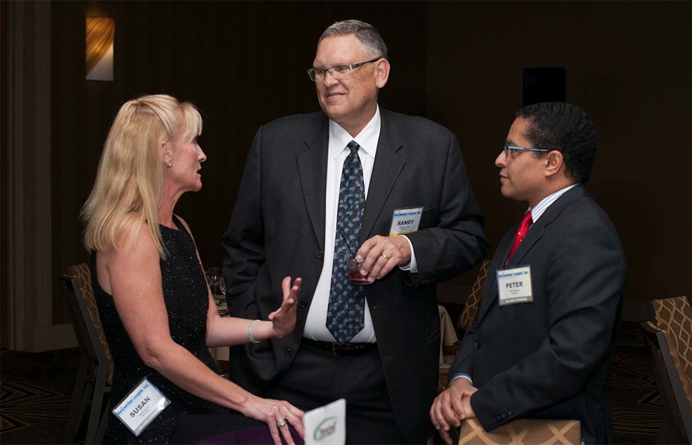 Bellwether Class of 2014 Honoree Randy Lipps (center) is flanked by Silver Sponsor Omnicell’s Susan Burns (left) and Peter Balcarce (right).