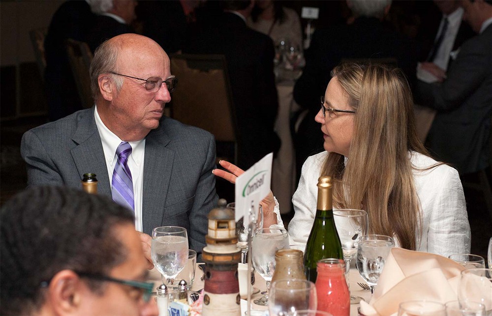 Kathy Lipps (right), wife of Bellwether Class of 2014 Honoree Randy Lipps, chats with Silver Sponsor Omnicell’s Grant Canfield.