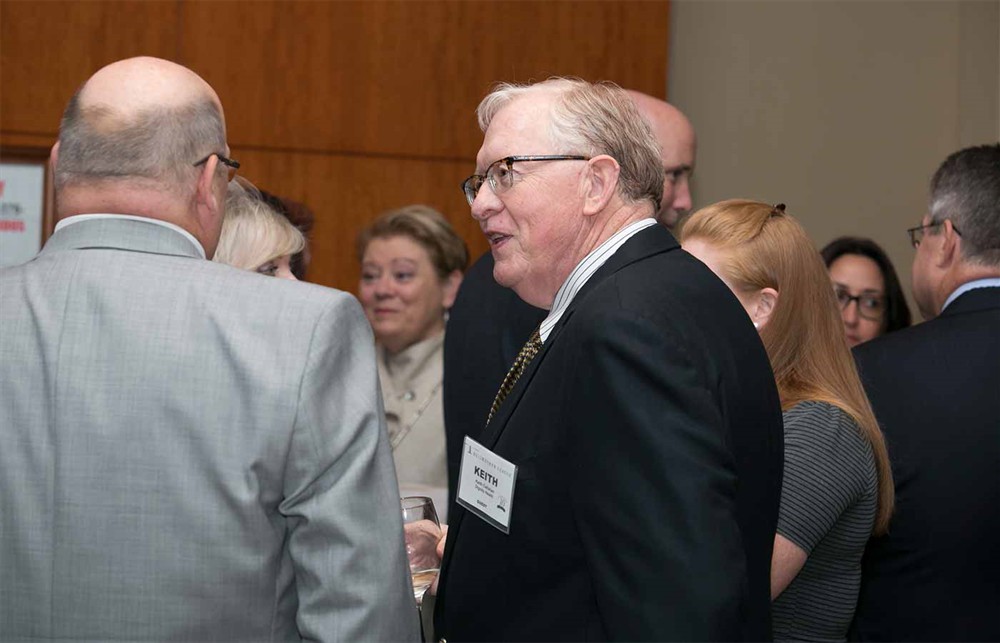 Dignity Health’s Keith Callahan with Bellwether Class of 2017 Honoree Jim Oliver (left, back to camera) from Yankee Alliance.