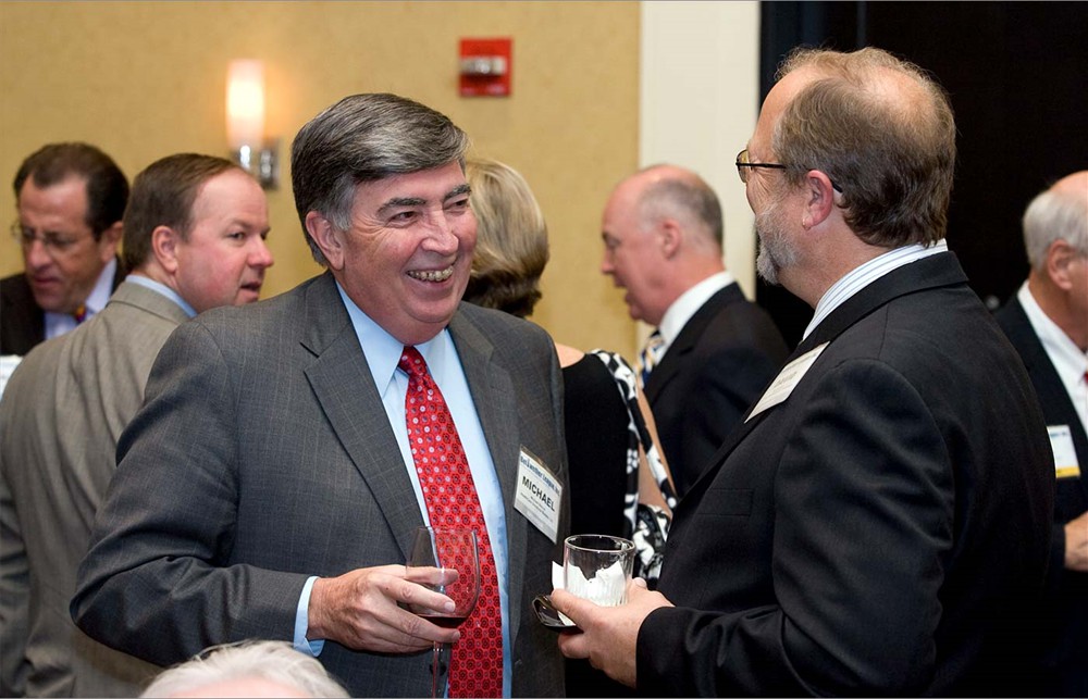 Health Care Solutions Bureau’s Michael Bohon laughs with University HealthSystem Consortium’s David Wood.