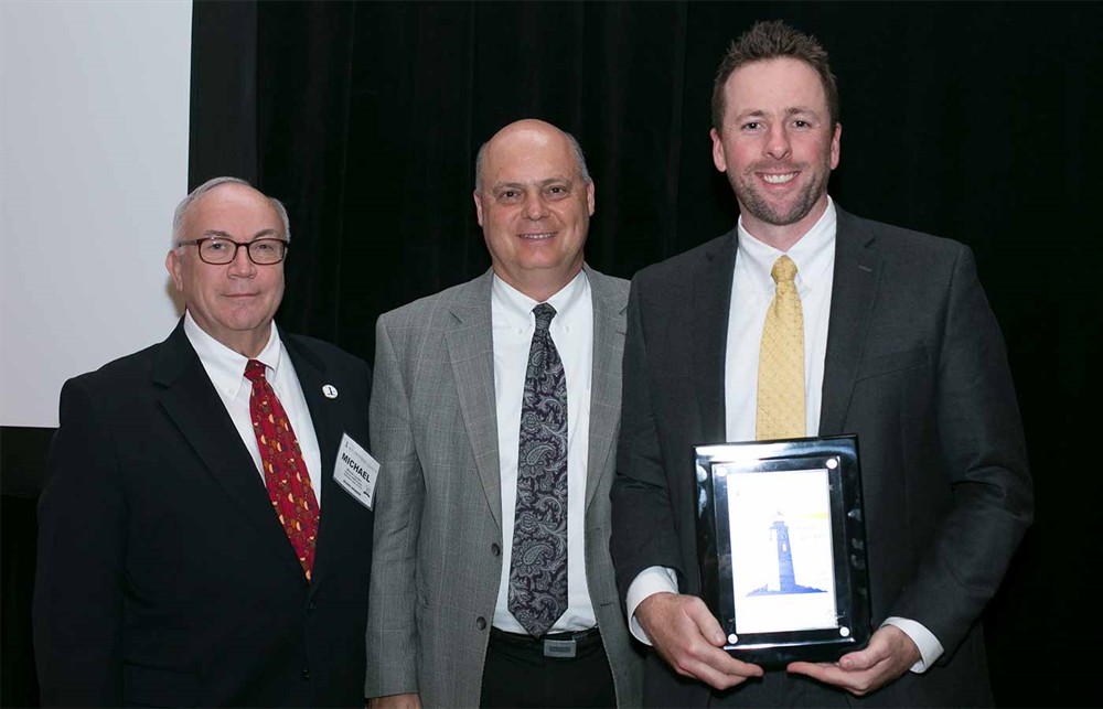 Ochsner Health’s Michael Louviere, Lloyd Gravolis and Mark Growcott, Ph.D., accept the 2016 Dean S. Ammer Award for Supply Chain Excellence, on behalf of their Ammer Level 4 Supply Chain Organization.