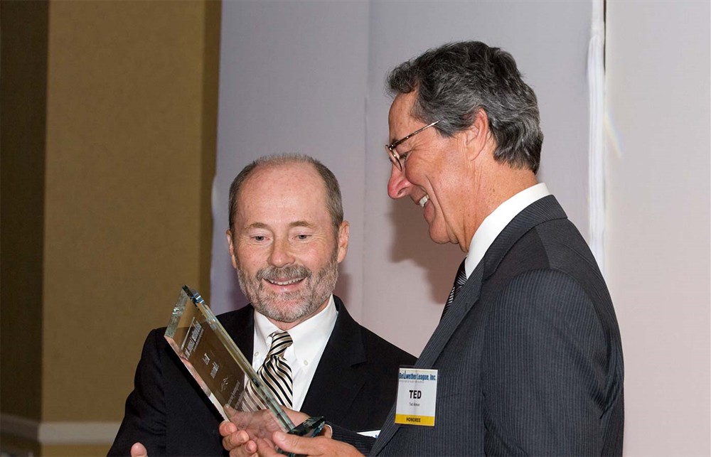 Armin Cline (center) (from Silver Sponsor Covidien) talks with Bellwether League Inc. Board Member Vance B. Moore (left). Bellwether League Inc. Co-Founder and Executive Director Rick Dana Barlow is in the background on the left.