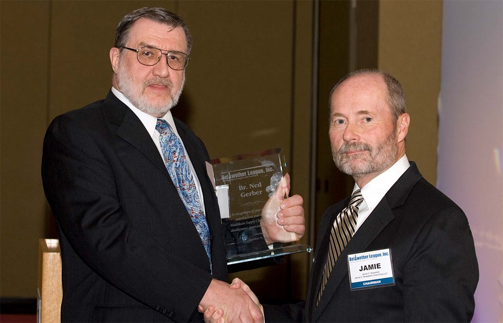 Br. Kirt Gerber accepts the award from Chairman Jamie Kowalski for Bellwether Class of 2010 Inductee Br. Ned Gerber, his brother by family and ministry.