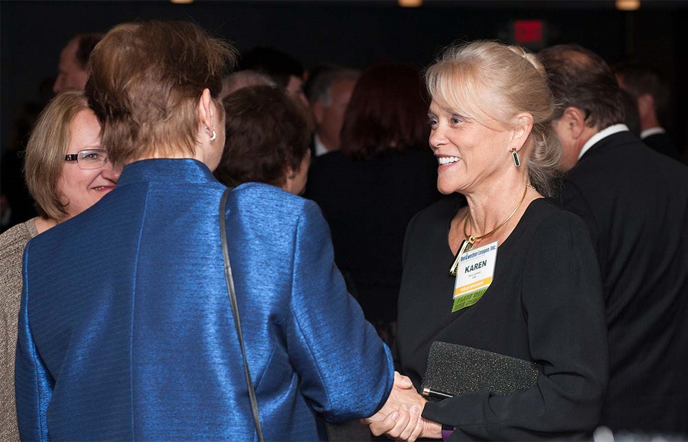 Bellwether League Inc. Board Member Vance Moore (center) chats with Bellwether Class of 2013’s Lynn Britton (left) as ROi’s Gene Kirtser (right) looks on.