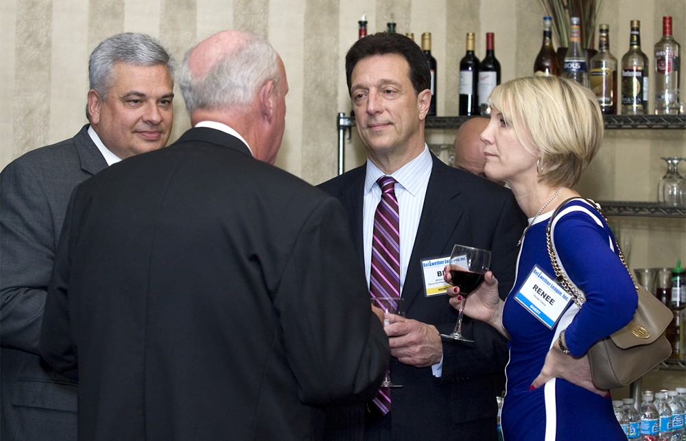 Bellwether League Inc. Board Member Jim Francis (far left) and Bellwether Class of 2012’s Tom Hughes (back to camera) talk with Bellwether Class of 2013’s Bill Donato and his partner Renee Casey (far right).