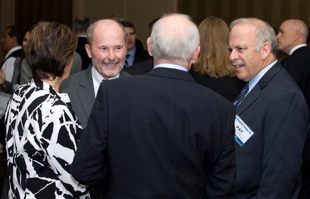 Jamie Kowalski and Pat Carroll with Mike Rosser (back to camera) and his wife Kathy.