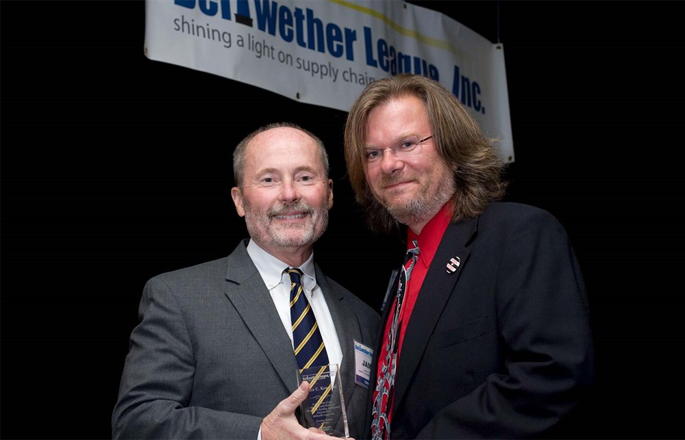 Jamie Kowalski accepts the Founding Board Member recognition award from Rick Barlow.