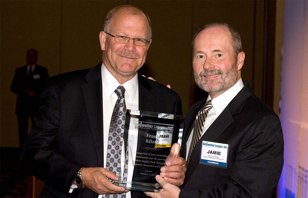 Frank Kilzer accepts the award from Chairman Jamie Kowalski.