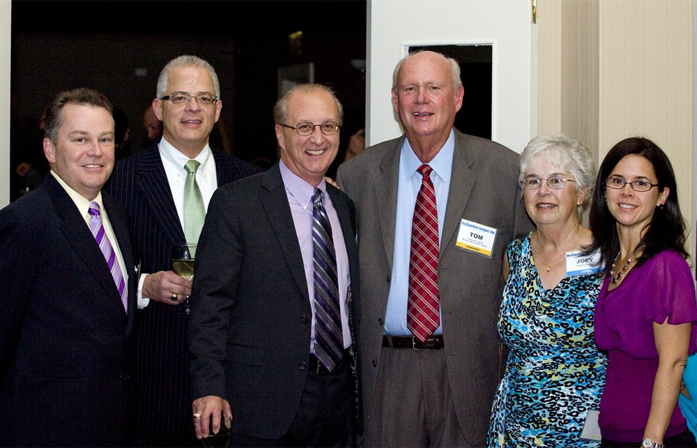 (From left to right) SMI’s Dennis Orthman, Premier’s Marv Feldman, CT + Associates’ Chris Troiano, Bellwether Class of 2012’s Tom Hughes, wife Josephine Hughes and daughter Jessica Hughes