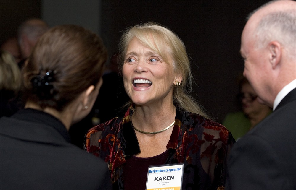 Karen Conway from Gold Sponsor GHX emphasizes a point with AHRMM’s Deb Sprindzunas (left, back to camera) and Bellwether League’s Vance Moore