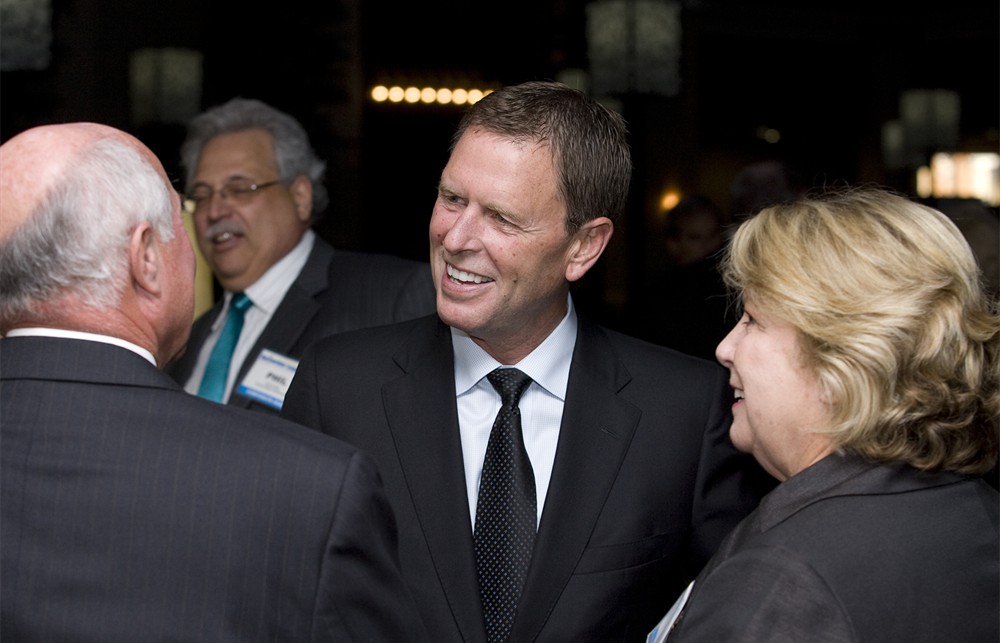 Covidien’s Armin Cline congratulates Carl Manley and Susan Manley