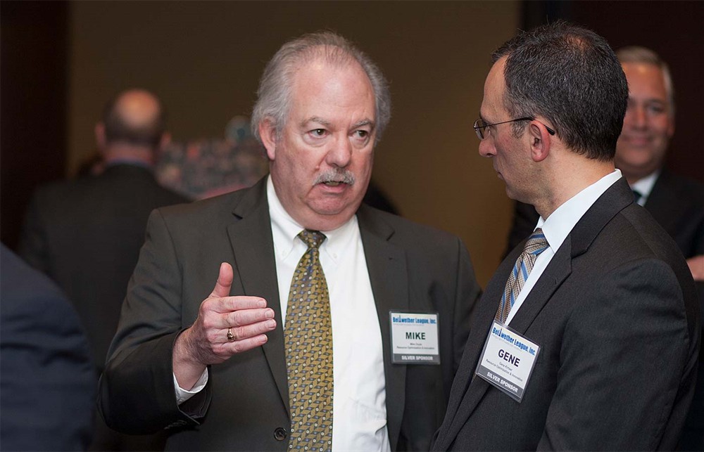 Silver Sponsor ROi’s Mike Doyle (left) with ROi’s Gene Kirtser (right).