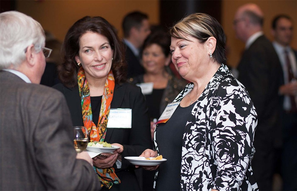 Corporate Sponsor TECSYS’ Nancy Pakieser (right) and Catherine Sigmar (center) with Bellwether League Inc. Board Member John Strong (left).