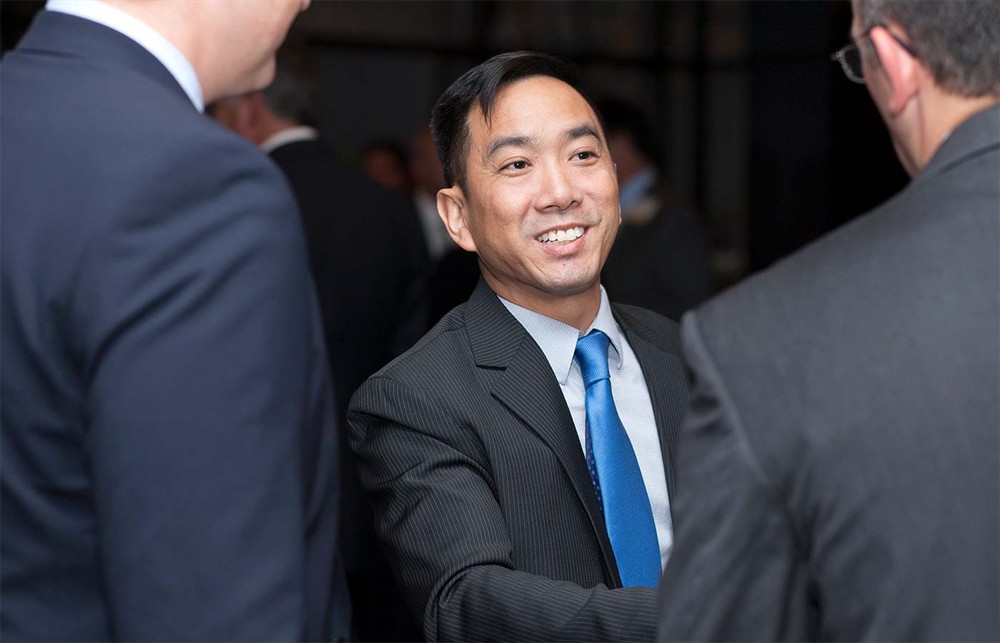 Gold Sponsor GHX’s Wally Fong (center) meets Silver Sponsor ROi’s Gene Kirtser (right).