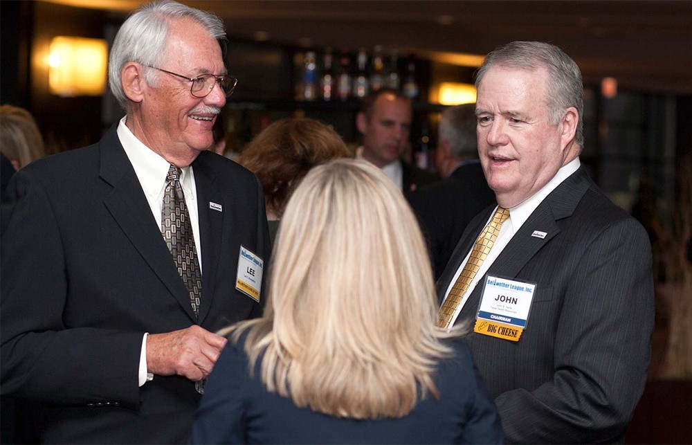 Lee Boergadine (Bellwether Class of 2008) (left) with Bellwether League Inc. Chairman John Gaida (right) flank Silver Sponsor ROi’s Kathie Woehrmann (center with back to camera).