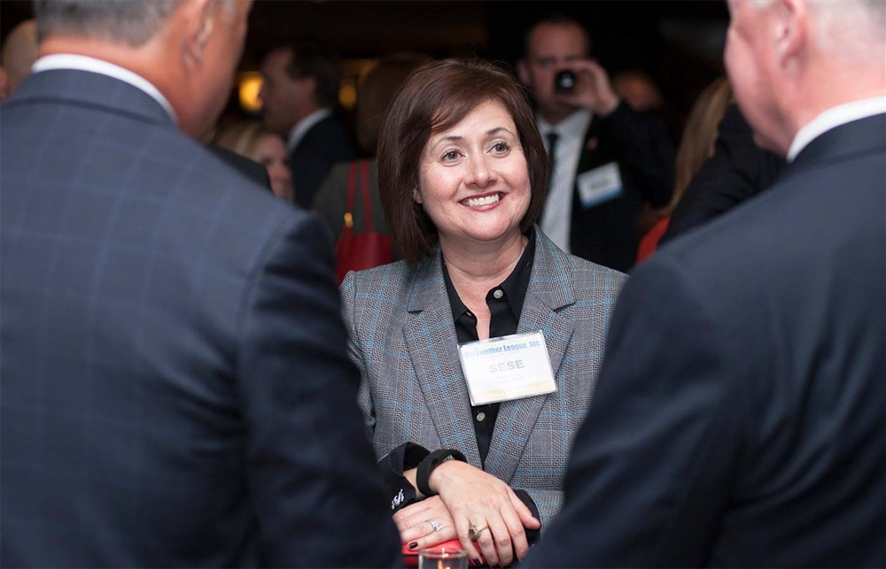 Gold Sponsor Cardinal Health’s SeSe Yennes with Cardinal Health’s Steve Inacker (left, back to camera) and Bellwether League Inc. Board Member Vance Moore (right, back to camera).