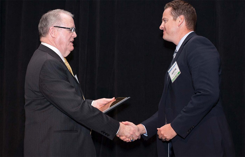 Bellwether League Inc. Chairman John Gaida (left) greets Justin Freed (Future Famers Class of 2015).