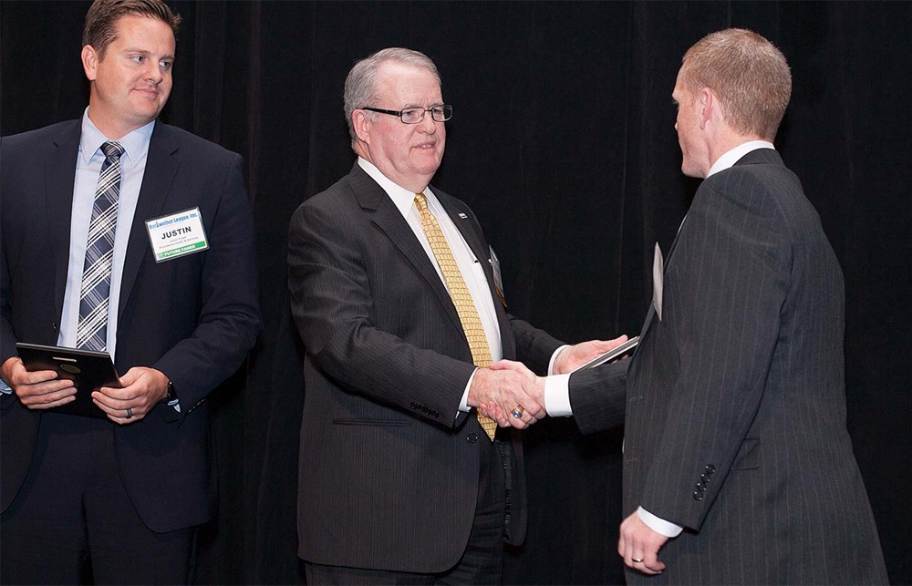 Bellwether League Inc. Chairman John Gaida (left) greets Jason Hays (Future Famers Class of 2015).