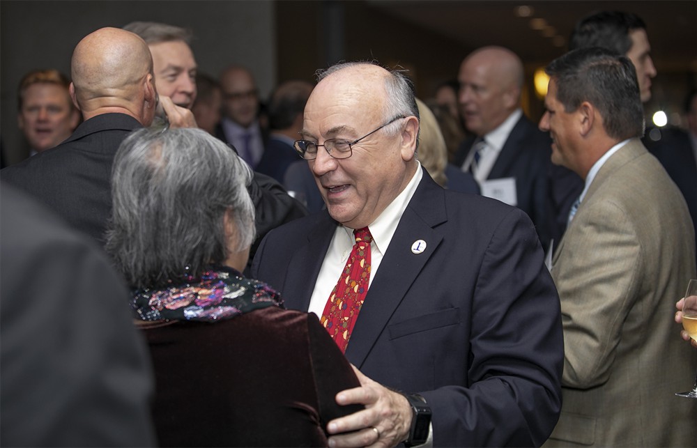Ochsner’s Michael Louviere (Bellwether Class of 2010) embraces Fe Carroll, wife of the late Pat Carroll (Bellwether Class of 2018).