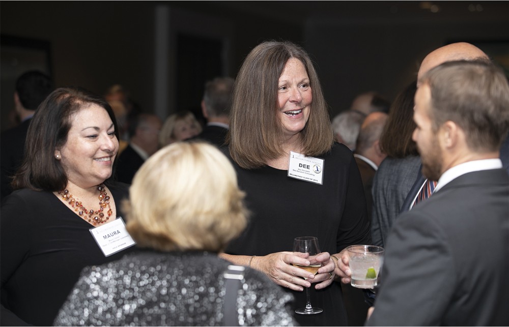 Bellwether League’s Dee Donatelli (center) with TractManager’s Maura Connor (left), SMI’s Barry Blake (right) and Winifred Hayes (Bellwether Class of 2018) (back to camera).