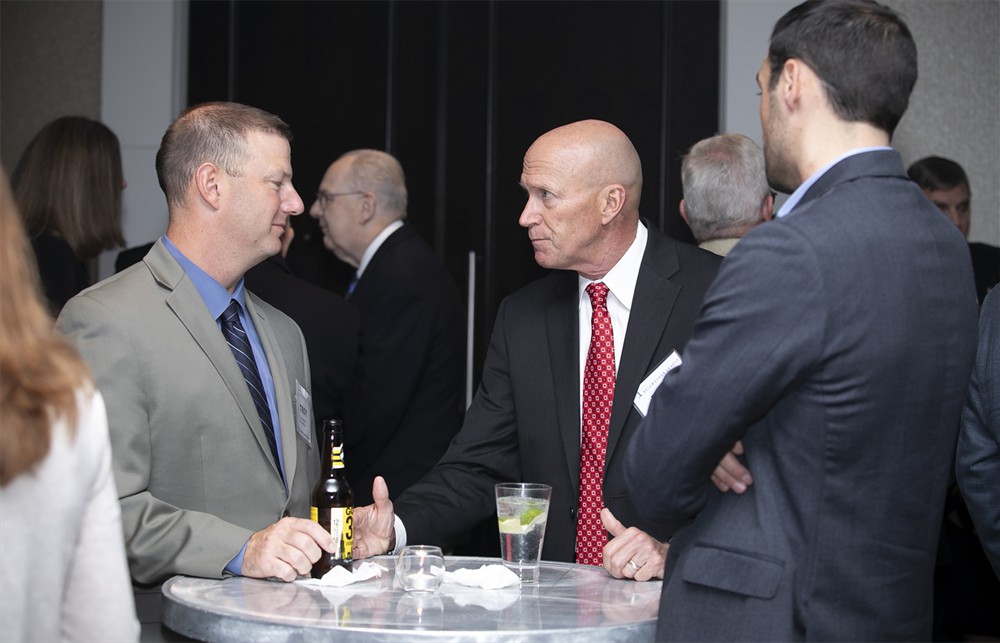BJC HealthCare’s Troy Compardo (Future Famers Class of 2018) (left) with Vizient’s Brian Hayungs (Founding Sustaining Sponsor) and UChicago’s Eric Tritch (Future Famers Class of 2015) (right, back to camera).