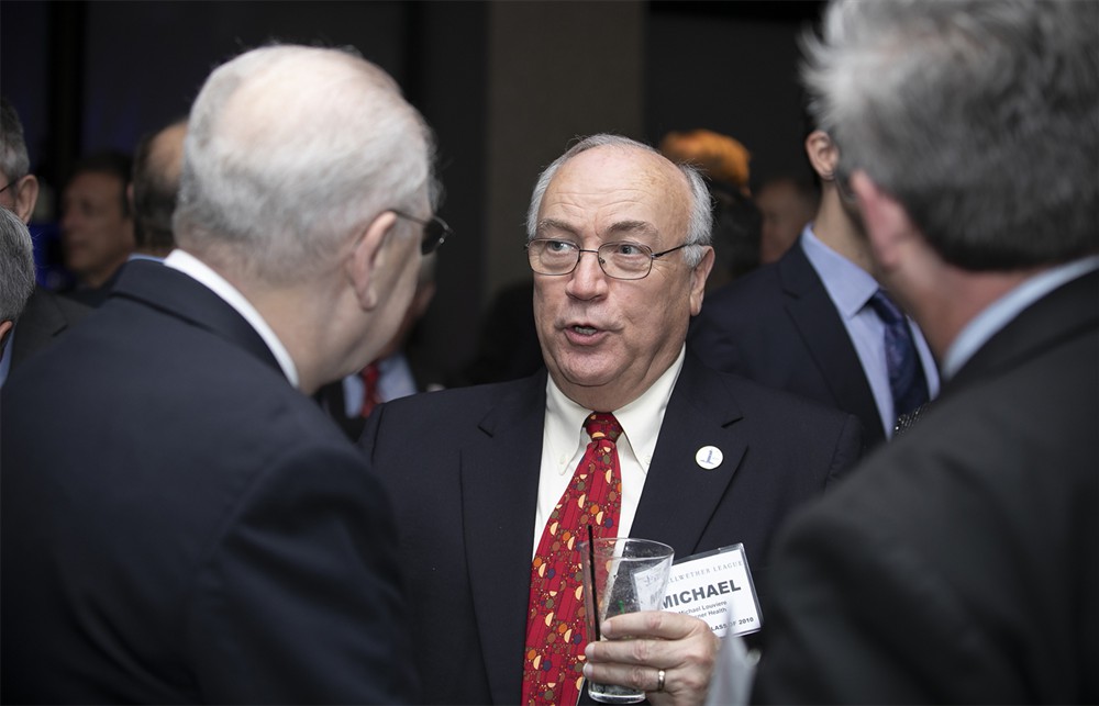 Ochsner’s Michael Louviere (Bellwether Class of 2010) (Bronze Sustaining Sponsor) with Robert T. Yokl (Bellwether Class of 2018) (left, back to camera) and Robert W. Yokl (right, back to camera).