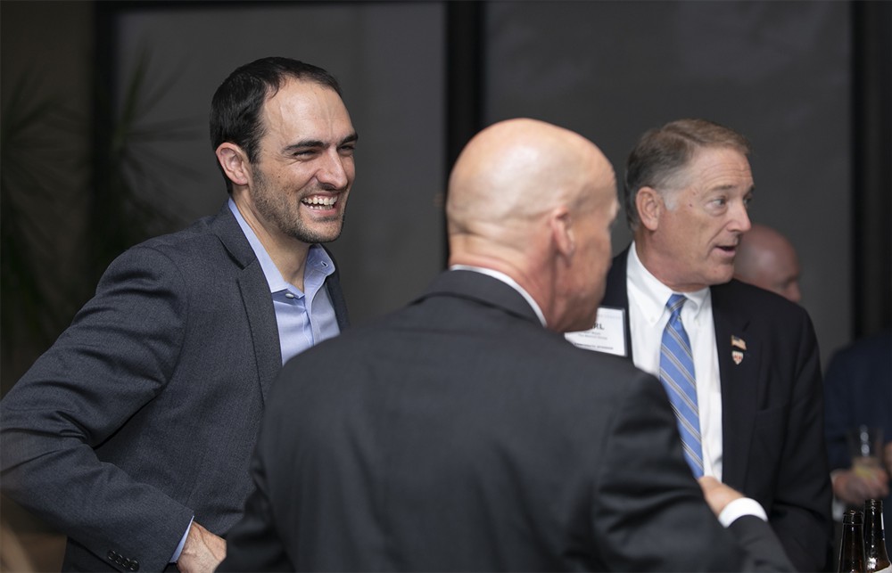 UChicago’s Eric Tritsch (Future Famers Class of 2015) (left) with Vizient’s Brian Hayungs (center, back to camera) and The Wetrich Group’s Carl Meyer (right).