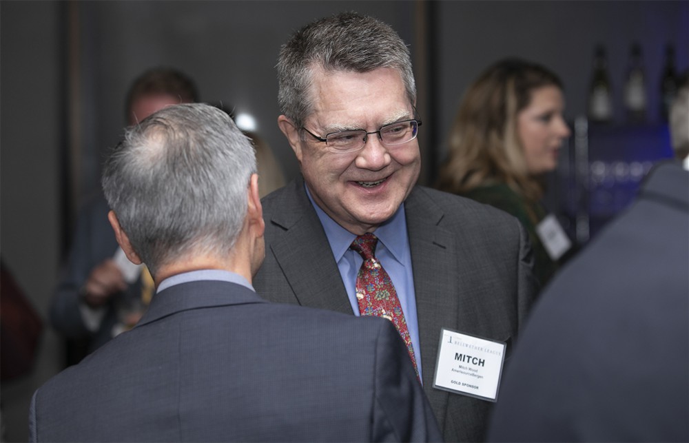 AmerisourceBergen’s Mitch Wood (Gold Sustaining Sponsor) with NCI Consulting’s Jim Dausch (left, back to camera).