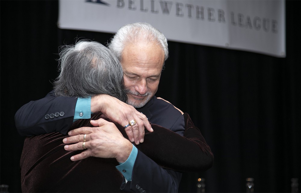Nick Gaich greets Fe Carroll, wife of the late Pat Carroll (Bellwether Class of 2018).